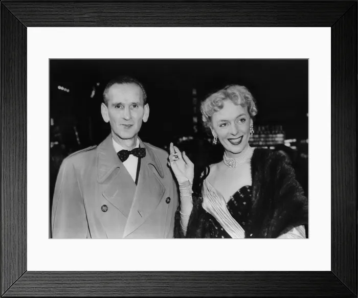 Framed Print : Christine Jorgensen arrives at theater with her escort, Charles Yates on Dec. 22, 1953 Framed Print : Christine Jorgensen arrives at theater with her escort, Charles Yates on Dec. 22, 1953