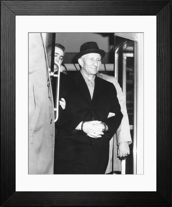 Framed Print : Handcuffed Carlo Gambino is led from FBI headquarters on March 23, 1970 Framed Print : Handcuffed Carlo Gambino is led from FBI headquarters on March 23, 1970