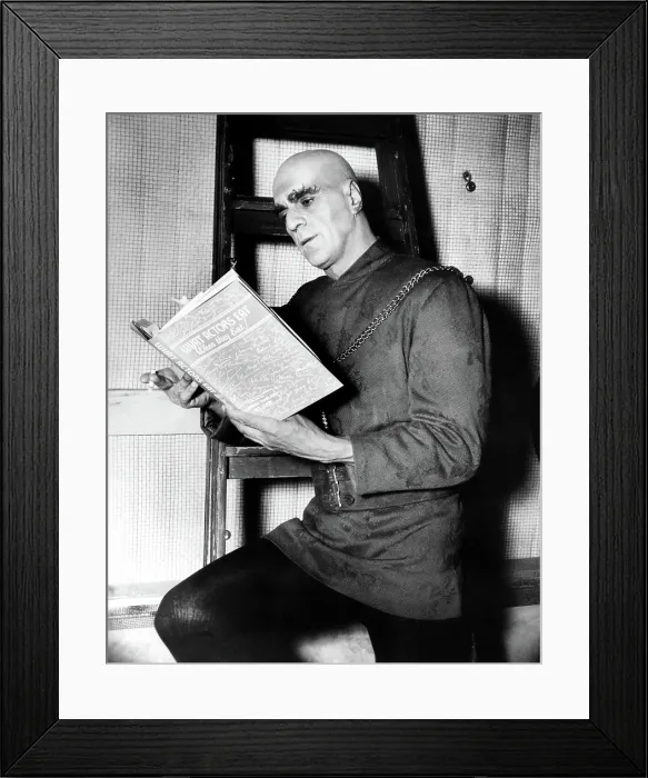 Framed Print : TOWER OF LONDON, BORIS KARLOFF enjoys a cigarette and a read during a production break, 1939 Framed Print : TOWER OF LONDON, BORIS KARLOFF enjoys a cigarette and a read during a production break, 1939