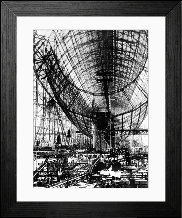 Framed Print : Hindenburg Airship under construction. The almost complete steel frame at the Zeppelin works at Friedrichshafen, Germany. Mechanics work in the right foreground. Nov. 24, 1934 Framed Print : Hindenburg Airship under construction. The almost complete steel frame at the Zeppelin works at Friedrichshafen, Germany. Mechanics work in the right foreground. Nov. 24, 1934