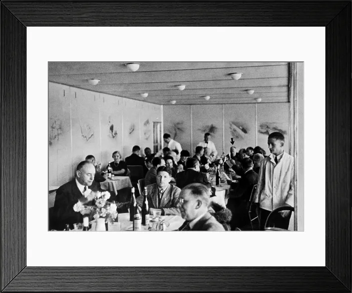 Framed Print : Dining 2, 000 feet in the air on the Hindenburg with wine on every table. Dr. Hugo Eckener, the manager of the Luftschiffbau Zeppelin, is at the head of the Long Table Framed Print : Dining 2, 000 feet in the air on the Hindenburg with wine on every table. Dr. Hugo Eckener, the manager of the Luftschiffbau Zeppelin, is at the head of the Long Table