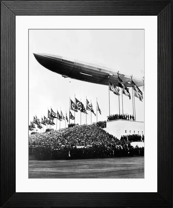Framed Print : The Hindenburg, flying low in salute of the Nazi hosts of the Nuremberg Congress. Shortly afterward it departed for the United States. October 20, 1936 Framed Print : The Hindenburg, flying low in salute of the Nazi hosts of the Nuremberg Congress. Shortly afterward it departed for the United States. October 20, 1936