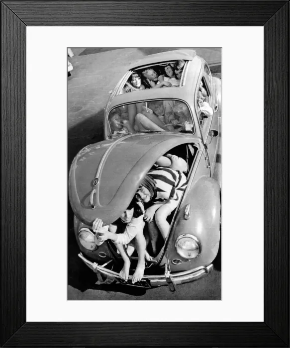 Framed Print : 31 teenagers stuffed into a Volkswagen Beetle. Ladera Vista Junior High School students succeeded in setting a new record. Buena Park, California. Dec. 5, 1964 Framed Print : 31 teenagers stuffed into a Volkswagen Beetle. Ladera Vista Junior High School students succeeded in setting a new record. Buena Park, California. Dec. 5, 1964