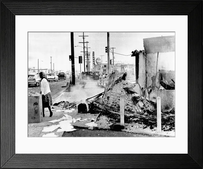Framed Print : Aftermath of 2 days of rioting, burning, and looting in Watts. A drive-in restaurant smolders and, in the background is an overturned, burned automobile Framed Print : Aftermath of 2 days of rioting, burning, and looting in Watts. A drive-in restaurant smolders and, in the background is an overturned, burned automobile