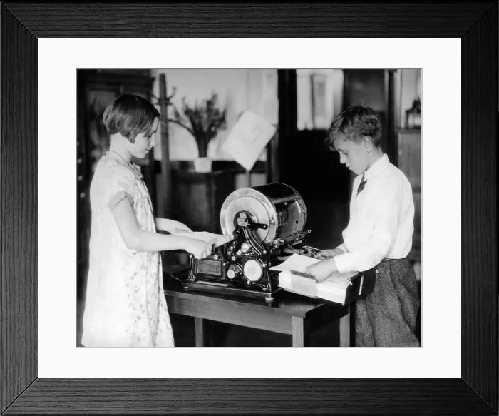 Framed Print : School children work on a mimeograph machine Framed Print : School children work on a mimeograph machine