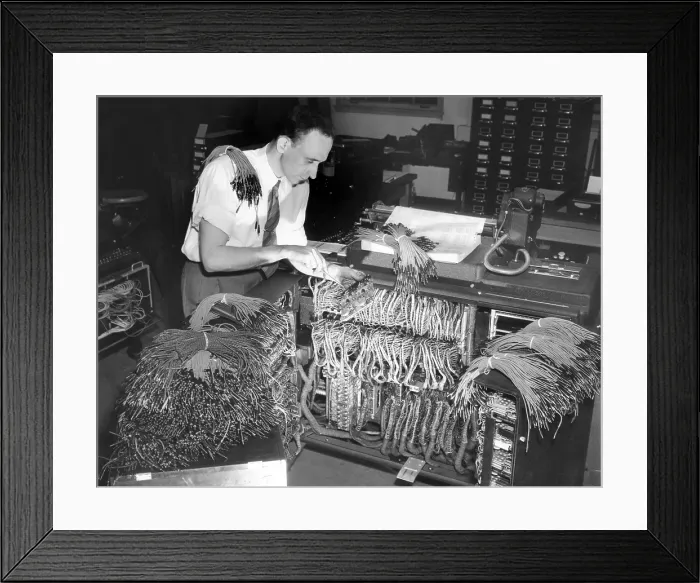 Framed Print : A engineer works on a IBM computer used to administer the Gl insurance dividend for millions of veterans
