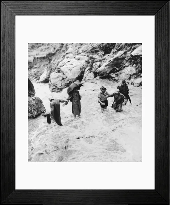Framed Print : Sir Edmund Hillary's Himalayan expedition crossing a mountain torrent. Sir Edmund Hillary is at extreme right