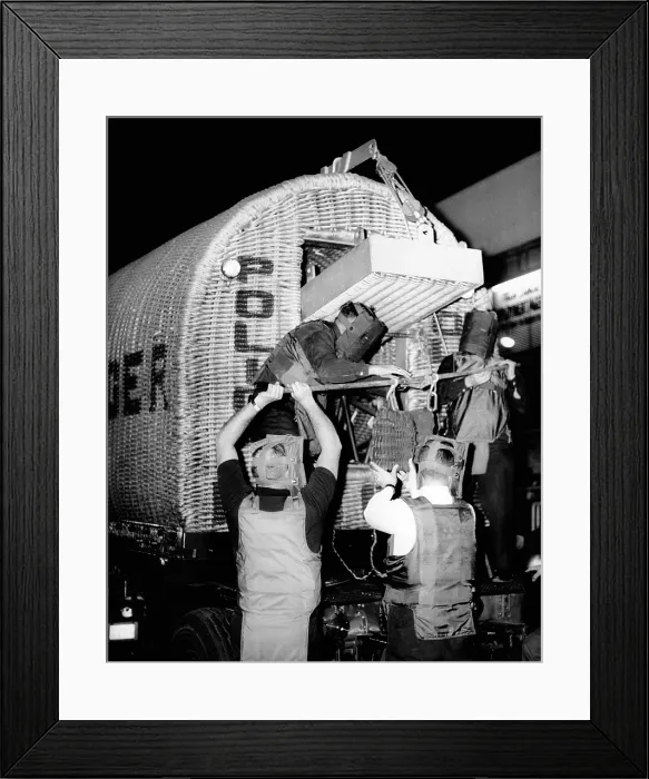 Framed Print : Police dispatch a suspected bomb found in a bus terminal locker. The police bomb squad wear protective masks and shields as the place a suspected bomb in a wicker lined truck Framed Print : Police dispatch a suspected bomb found in a bus terminal locker. The police bomb squad wear protective masks and shields as the place a suspected bomb in a wicker lined truck