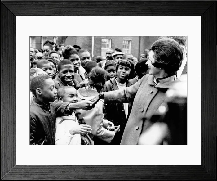 Framed Print : Lady Bird Johnson greets African American students in Washington, DC. She visited the school complex for over 3, 000 students to dedicate the new landscaping