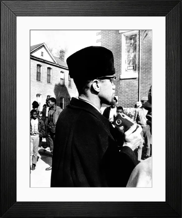 Framed Print : Malcolm X visits the voting rights protest in Selma, Alabama. He is about to photograph the church in which he spoke to protesters. Feb. 4, 1965