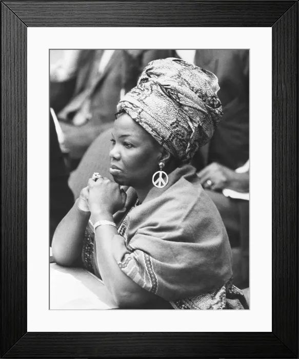Framed Print : Mrs. Jeanne Martin Cisse, wears peace symbol earrings at the U.N. Security Council. Nov. 16, 1972