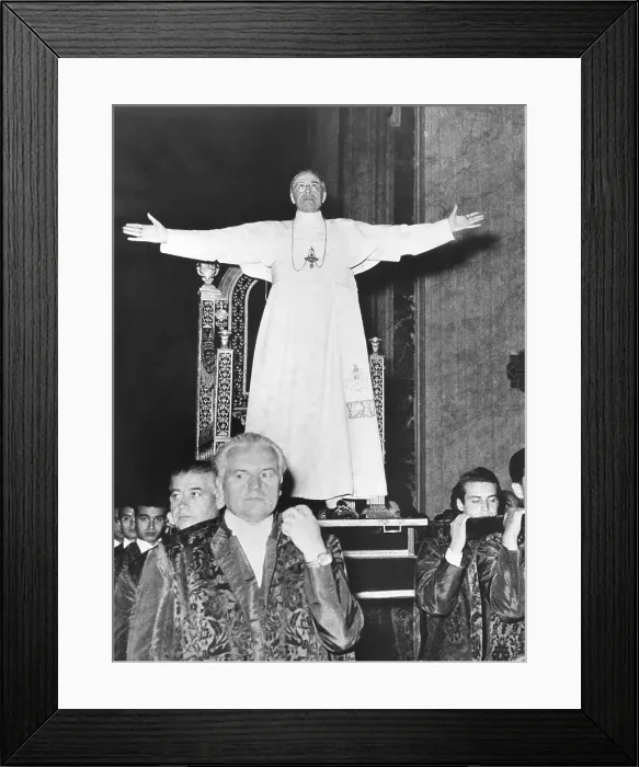 Framed Print : Pope Pius XII standing before his Sedia Gestatoria, a portable throne carried by twelve footmen. July 19, 1951 Framed Print : Pope Pius XII standing before his Sedia Gestatoria, a portable throne carried by twelve footmen. July 19, 1951