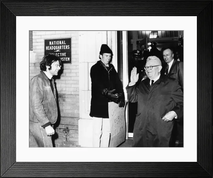 Framed Print : Gen. Lewis Hershey waves to protesters outside the Selective Service HQ after draft lottery. Dec. 1, 1969. (CSU_2015_9_956) Framed Print : Gen. Lewis Hershey waves to protesters outside the Selective Service HQ after draft lottery. Dec. 1, 1969. (CSU_2015_9_956)