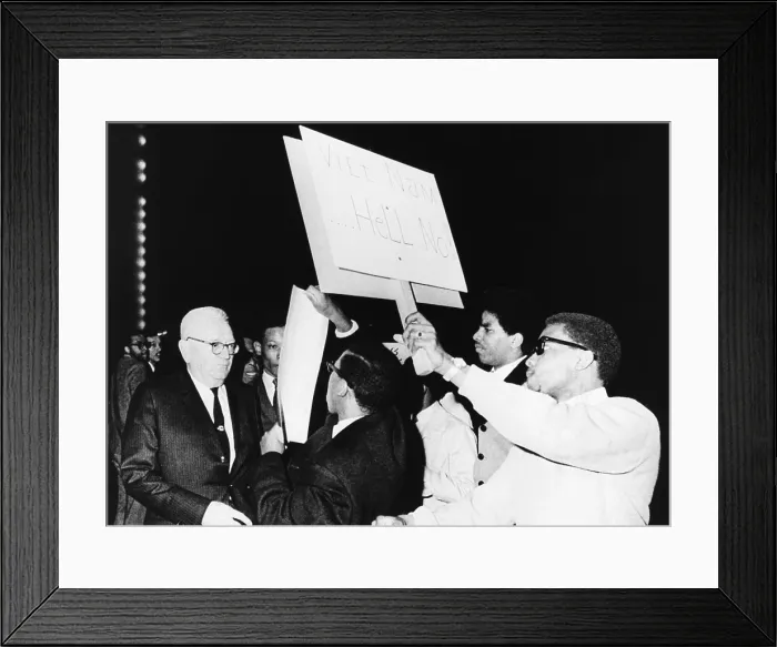 Framed Print : Draft Director Louis Hershey driven from the stage by anti-war protestors at Howard University. March 21, 1967. 50 African American students surrounded the 73 year old Gen
