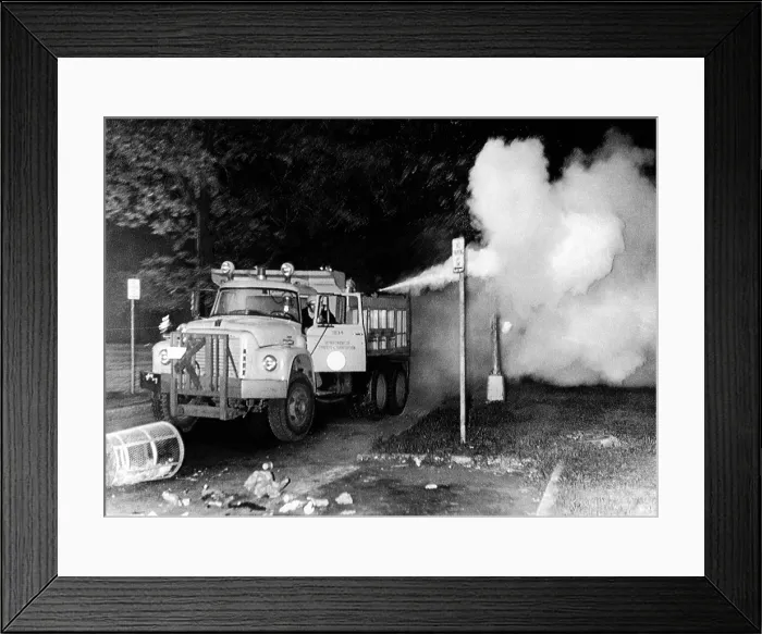 Framed Print : Tear gas is sprayed in into crowds assembled in Grant Park during the 1968 Democratic National Convention