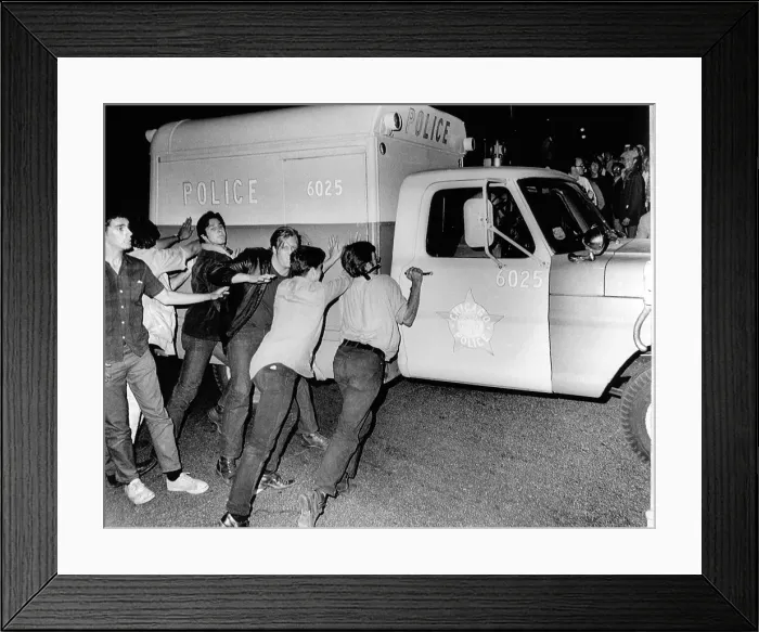 Framed Print : Battle of Michigan Avenue in Chicago, during the 1968 D emocratic National Convention. Anti-war demonstrators try t o push over a Chicago Police vehicle. Aug Framed Print : Battle of Michigan Avenue in Chicago, during the 1968 D emocratic National Convention. Anti-war demonstrators try t o push over a Chicago Police vehicle. Aug