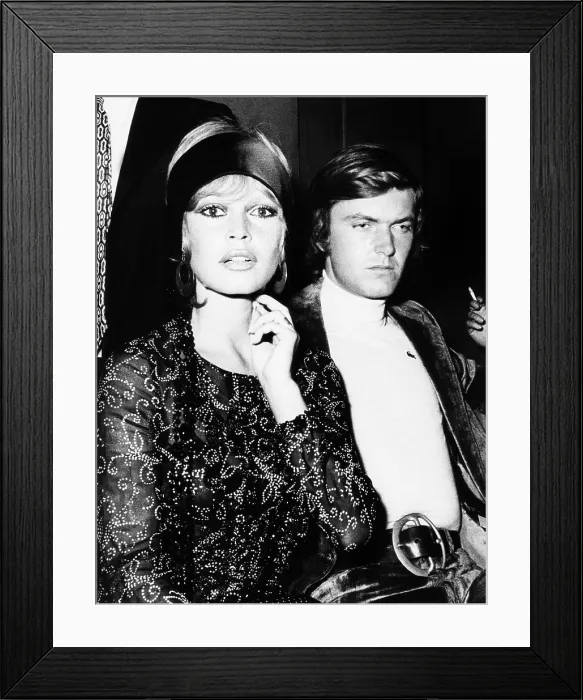 Framed Print : French actress Brigitte Bardot escorted by her 23 year old boyfriend Patrick Gilles. They were attending the show of singer, Sylvie Vartan. At the Paris, Olympia. Sept. 25, 1970 Framed Print : French actress Brigitte Bardot escorted by her 23 year old boyfriend Patrick Gilles. They were attending the show of singer, Sylvie Vartan. At the Paris, Olympia. Sept. 25, 1970