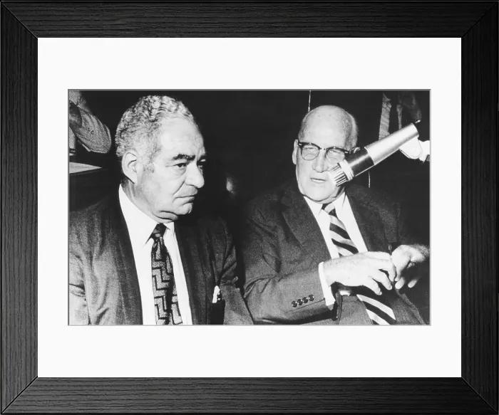 Framed Print : Sol Adoff (left) speaks with his lawyer John Toolan during testimony. June 24, 1970
