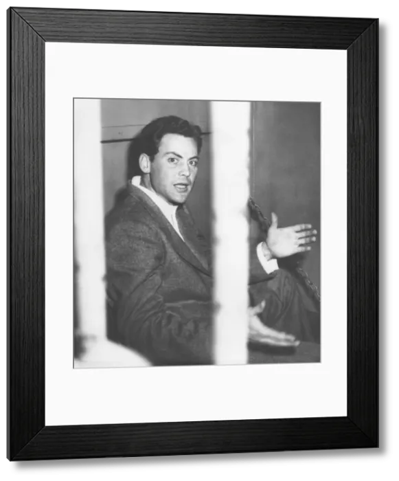 Framed Print : Actor John Agar, protests photographers taking his picture after his drunk driving arrest. Feb. 12, 1950. The 29 year old actor was recently divorced from Shirley Temple
