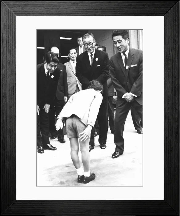 Framed Print : Prince Hiro bows before Orie Kitajima (center), President of the Dainippon Printing Company. Oct. 11, 1967 Framed Print : Prince Hiro bows before Orie Kitajima (center), President of the Dainippon Printing Company. Oct. 11, 1967