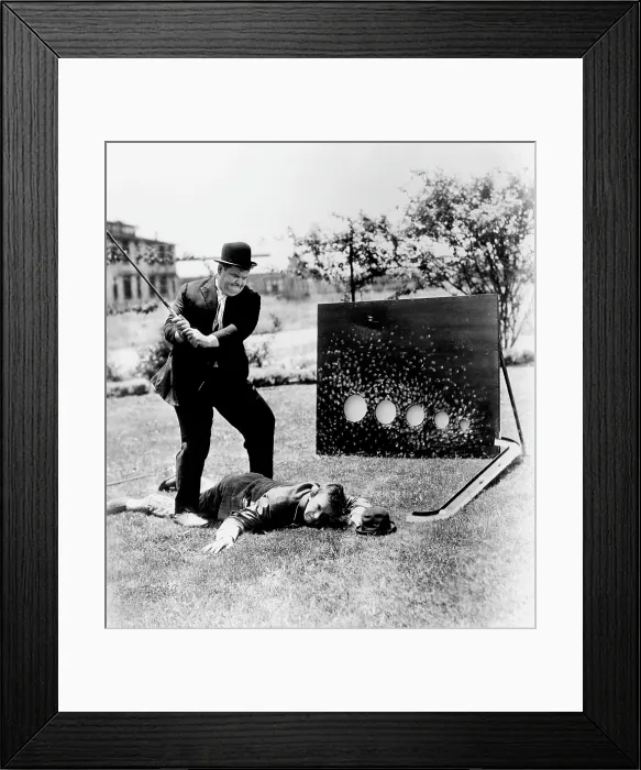 Framed Print : From left, Oliver Hardy, Stan Laurel, brushing up on their golf game, ca. 1930s