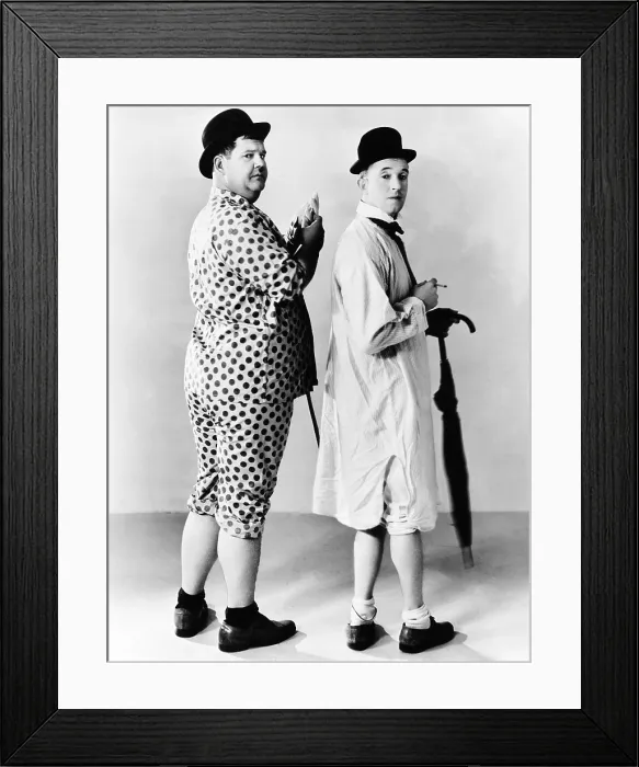 Framed Print : From left: Oliver Hardy, Stan Laurel, Hal Roach publicity shot, early 1930s