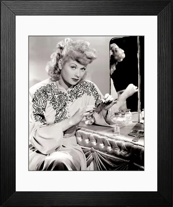 Framed Print : Lucille Ball sits at a vanity for a publicity still, 1940s