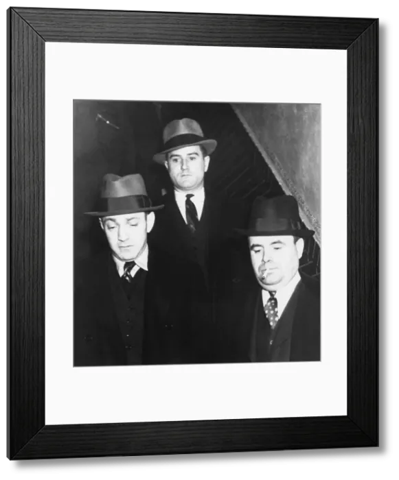 Framed Print : Dutch Schultz (left) leaving jail in Albany, New York. Also known as Arthur Flegenheimer, he was required to post a $75, 000 bond prior to his trial for tax evasion. Ca