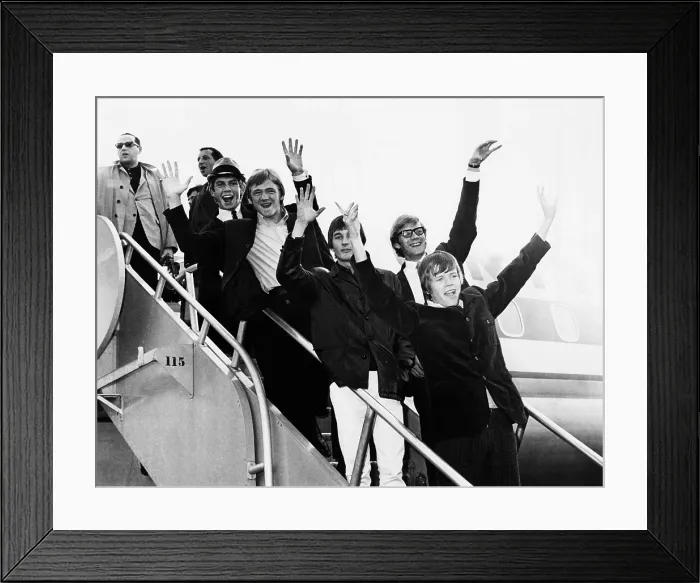 Framed Print : Herman's Hermits arrive in New York from a tour of Japan, Feb. 1966. At the time, the group out-ranked the Beatles in worldwide popularity polls. They were in the U.S