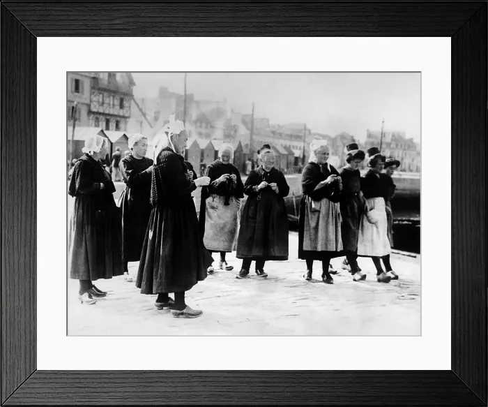 Framed Print : Wearing the unique costumes of Brittany, France, wives knits as they await the return of their fishermen husbands. Oct. 1926. (CSU_ALPHA_1536) CSU Archives / Everett Collection Framed Print : Wearing the unique costumes of Brittany, France, wives knits as they await the return of their fishermen husbands. Oct. 1926. (CSU_ALPHA_1536) CSU Archives / Everett Collection