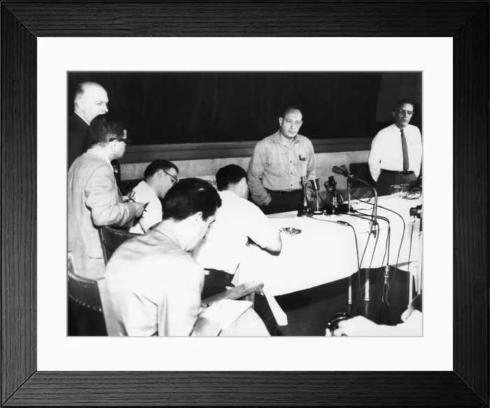 Framed Print : Nathan Leopold, 52 year old, speaks to the press at Statesville Penitentiary, July 31, 1957. The famous murderer had just been refused executive clemency by Gov. William Stratton