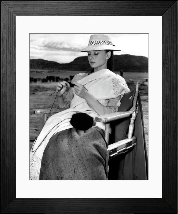 Framed Print : Audrey Hepburn, on location in Durango, Mexico knitting a cashmere sweater ca. 1959