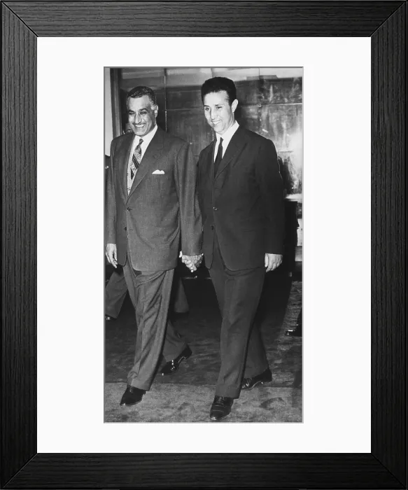 Framed Print : Gamal Abdel Nasser walks hand in hand with Algerian rebel leader Ahmed Ben Bella. April 17, 1962