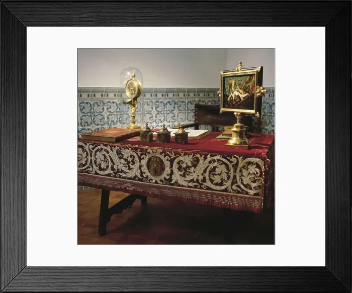 Framed Print : PHILIP II of Spain (1527-1598). Desk of Philip II. A painting of the martyrdom of Saint Lawrence (Florentine School) and a Hans de Evalo's clock stand out on the table (1583)