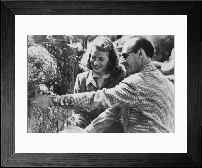 Framed Print : Ingrid Bergman and Roberto Rossellini became lovers during the filming of STROMBOLI, April 1949. Bergman is holding the flowers he collects, in the first months of their romance