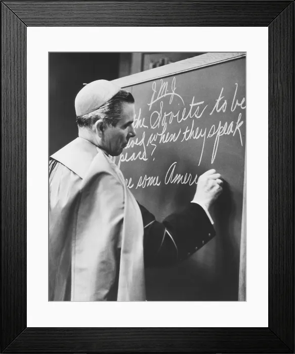Framed Print : Bishop Fulton Sheen writing on blackboard during the broadcast of his TV show, LIFE IS WORTH LIVING. Nov. 1, 1954