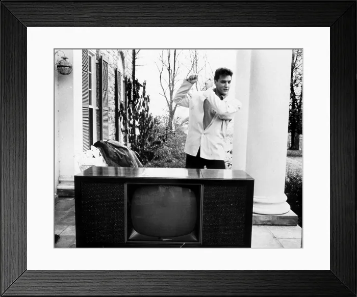Framed Print : Elvis Presley, on the Graceland porch with a new RCA television, 1960