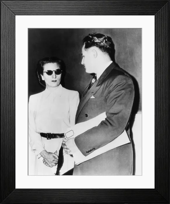 Framed Print : Annette Carvetto, widow of mob boss Frank Nitti, with her lawyer J. R. Stibel. She was subpoenaed to U.S. District Court over income taxes owed the government. August 1, 1946