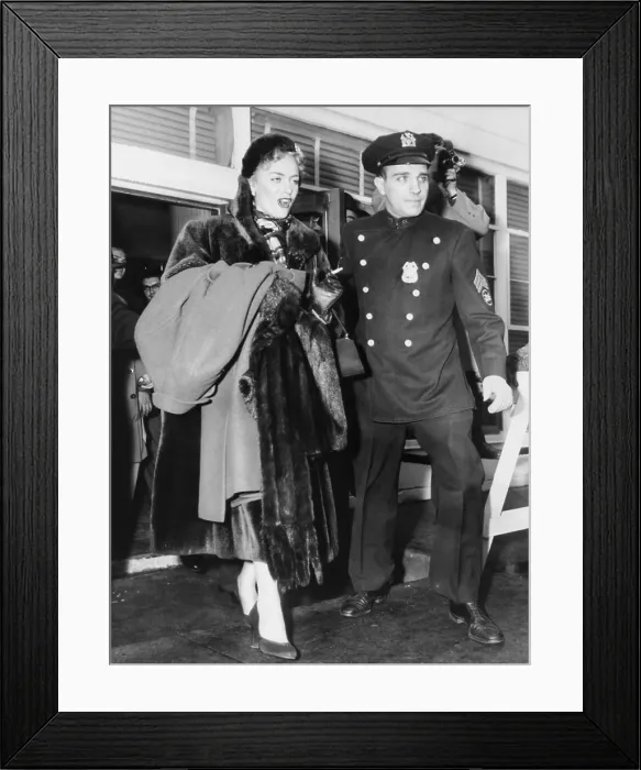 Framed Print : Christine Jorgensen, made her debut to the press at Idlewild Airport on Feb. 12, 1953