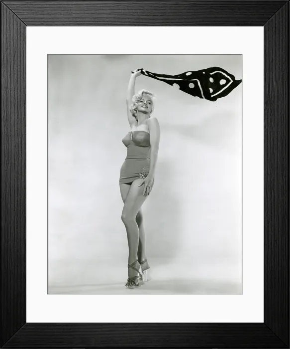 Framed Print : Marilyn Monroe in HOW TO MARRY A MILLIONAIRE, 1953, wearing a bathing suit by William Travilla. - Photo: Courtesy Everett Collection Framed Print : Marilyn Monroe in HOW TO MARRY A MILLIONAIRE, 1953, wearing a bathing suit by William Travilla. - Photo: Courtesy Everett Collection