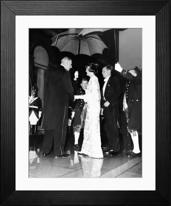Framed Print : French President Charles de Gaulle (left), greets President John and Jacqueline Kennedy at the Elysee Palace. Under the umbrellas, De Gaulle is in his dress uniform, and Mrs