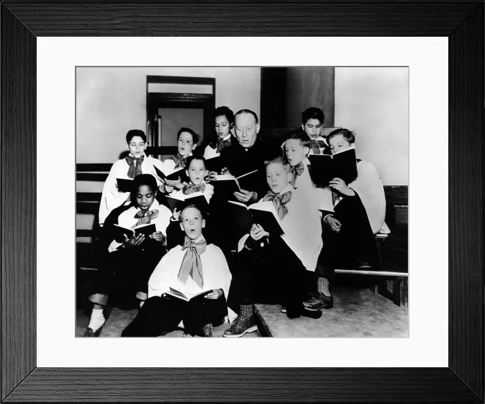 Framed Print : Boys Town Choir rehearsing for their Easter Week appearance on CBS radio. The Choir is directed by Rt. Rev. Monsignor Nicholas H. Wegner. April 1953