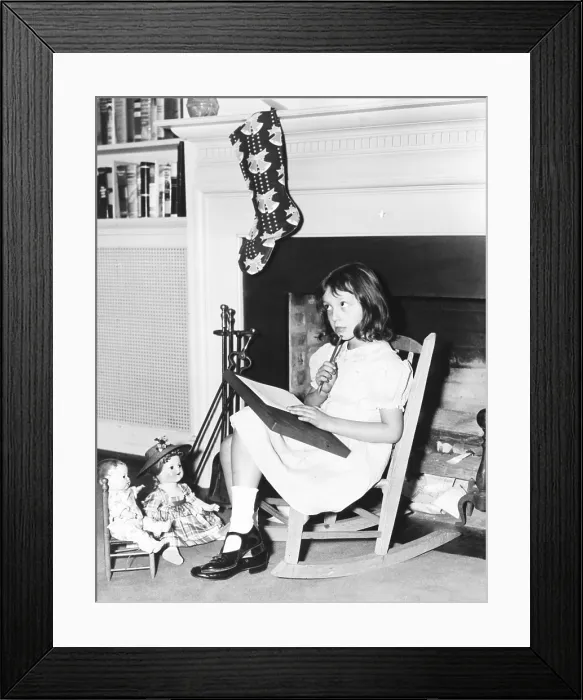 Framed Print : Diana Hopkins, daughter of Harry Hopkins, writing a note to Kris Kringle. She sits before the White House fireplace in a rocking chair given to her by Eleanor Roosevelt Framed Print : Diana Hopkins, daughter of Harry Hopkins, writing a note to Kris Kringle. She sits before the White House fireplace in a rocking chair given to her by Eleanor Roosevelt
