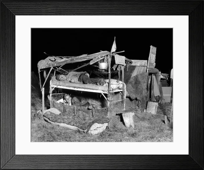 Framed Print : Bonus Veterans poor living conditions. Two men from Detroit sleep in their primitive beds in the Anacostia Flats encampment Framed Print : Bonus Veterans poor living conditions. Two men from Detroit sleep in their primitive beds in the Anacostia Flats encampment