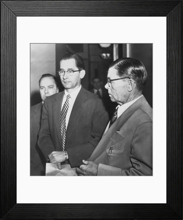 Framed Print : Dr. Albert Blumberg, an accused and admitted Communist, in handcuffs, Oct. 20, 1954