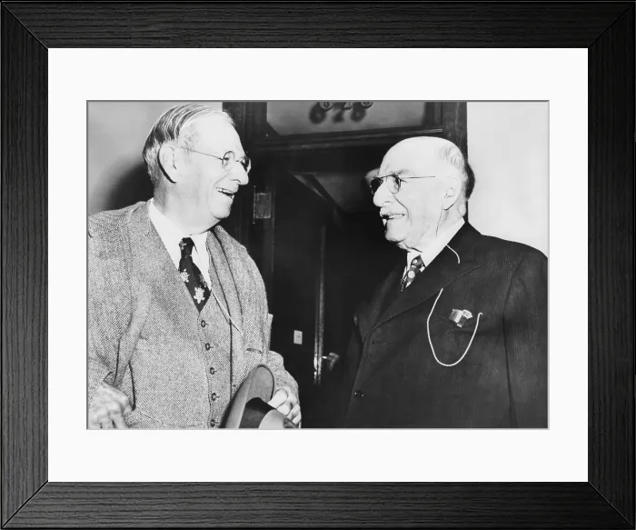Framed Print : Irenee DuPont (left) discusses the day's court proceedings with his brother, Pierre