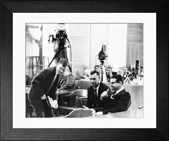 Framed Print : Billie Sol Estes sits at right as television cameras record the proceedings of his 1962 trial