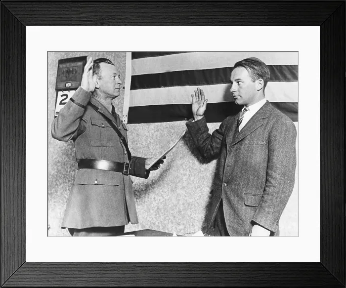 Framed Print : Heir to DuPont fortune, Alexis Felix DuPont (left) joins the army flying corps. He takes the oath of allegiance from Captain A.L. Barber of the U.S. Army in Camden, N.J. Nov