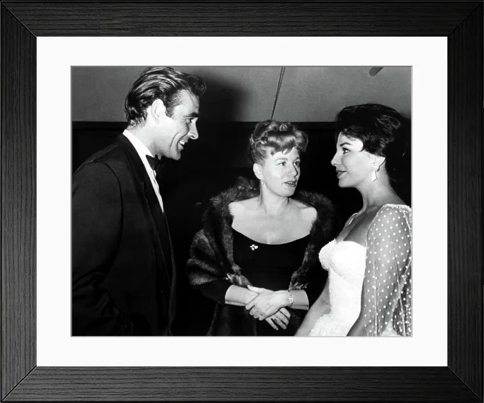 Framed Print : Newcomer SEAN CONNERY, chats with SHELLEY WINTERS and JOAN COLLINS at the Hollywood premiere party for THE VIKINGS, 1958 Framed Print : Newcomer SEAN CONNERY, chats with SHELLEY WINTERS and JOAN COLLINS at the Hollywood premiere party for THE VIKINGS, 1958