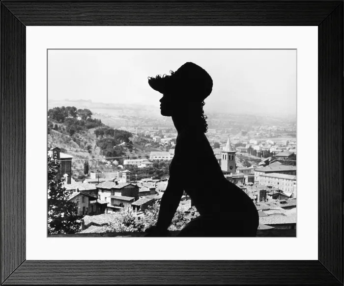 Framed Print : Silhouette portrait of French Actress Brigitte Bardot against a view of Spoleto, Italy. Dec. 8, 1961. Bardot was shooting on location for the MGM film, A VERY PRIVATE AFFAIR